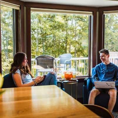 Brown dining room windows by outdoor patio