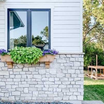 Outside view of kitchen window with plants