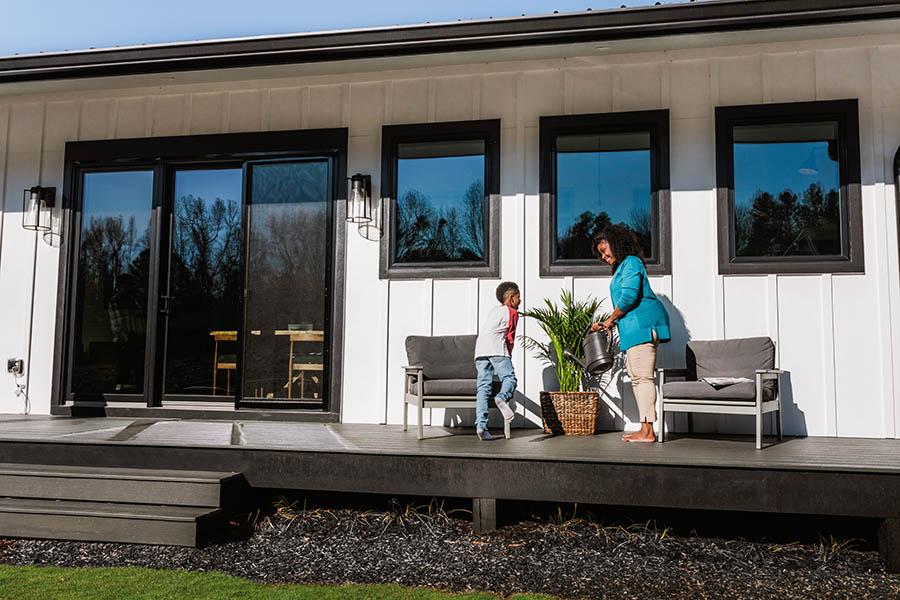 A 3-panel Andersen sliding patio door connects this home with its deck