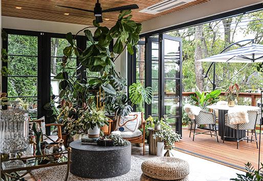 Hilton Carter’s sunroom features a Folding Outswing door connecting to a deck 