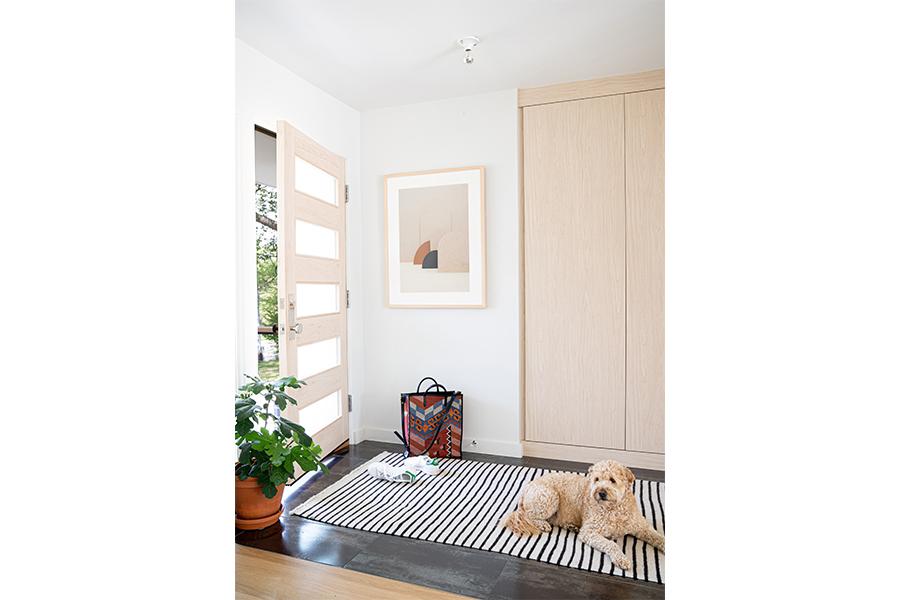 view of entryway with dog laying on dog bed