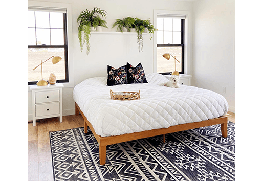 fargo farmhouse modern bedroom with black windows over nightstands