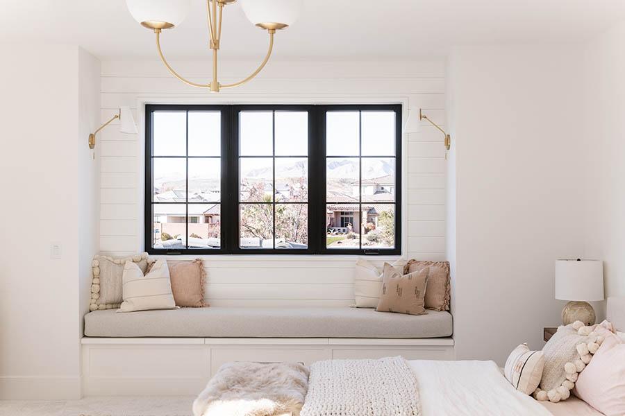 Becki Owens' pink and neutral bedroom with black windows