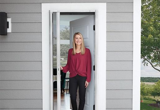 woman walking out of front door way