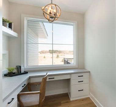 working desk area with white framed 200 series andersen windows