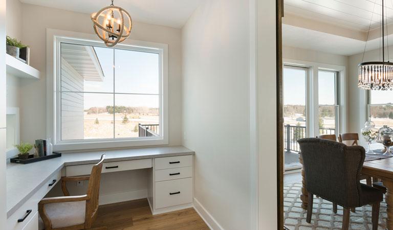 desk area with white framed 200 series andersen windows